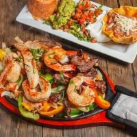 Fajitas Mixtas · Sizzling skillet of caramelized onions and bell peppers with a combination of shrimp and ste...