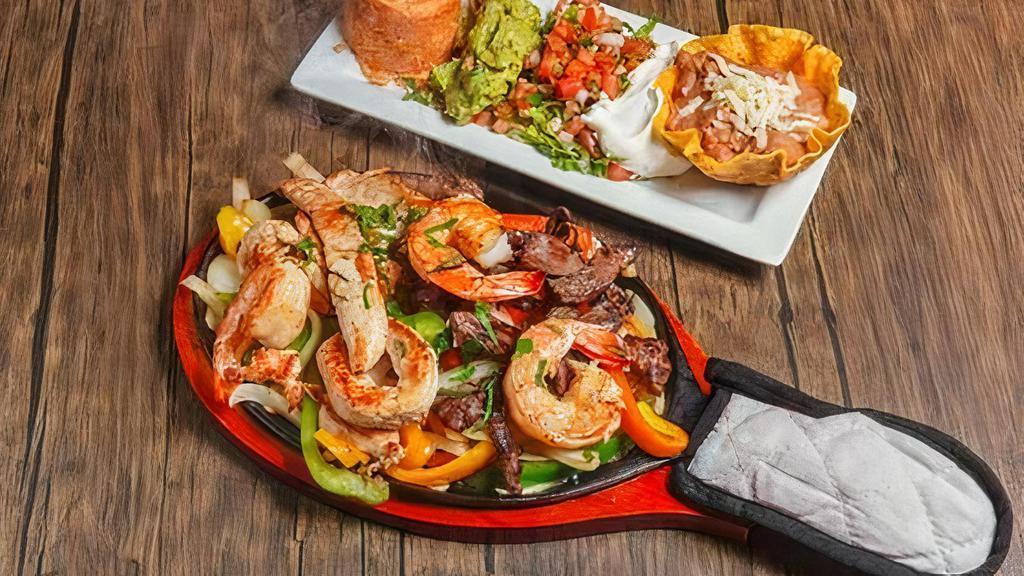 Shrimp Fajitas · Sizzling skillet of caramelized onions and bell peppers with marinated grilled shrimp.