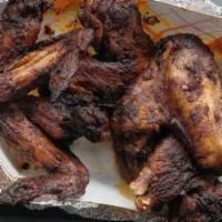 6 Jerk Wings · Served with choice of two sides only jamaican bread and jerk sauce.