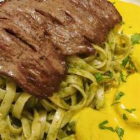 Tallarines Verdes Con Bistec · Pasta with basil-based sauce topped with a thin slice of steak.  (includes a small portion o...