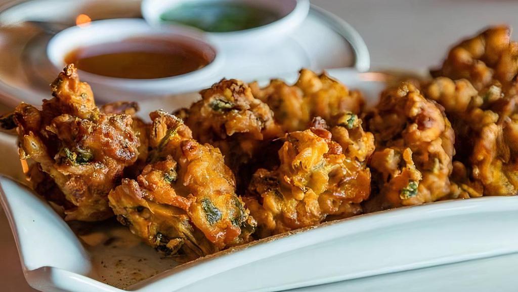 Mix Pakora · Fresh cut vegetables seasoned with special spices fried in chickpea batter.