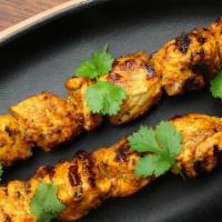 Tandoori Chicken Tikka · Chunks of boneless chicken breast marinated in freshly ground spices with saffron.