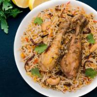 Fb'S Chicken Biryani · Marinated chicken and saffron flavored basmati rice with herbs and spices, garnished with ra...