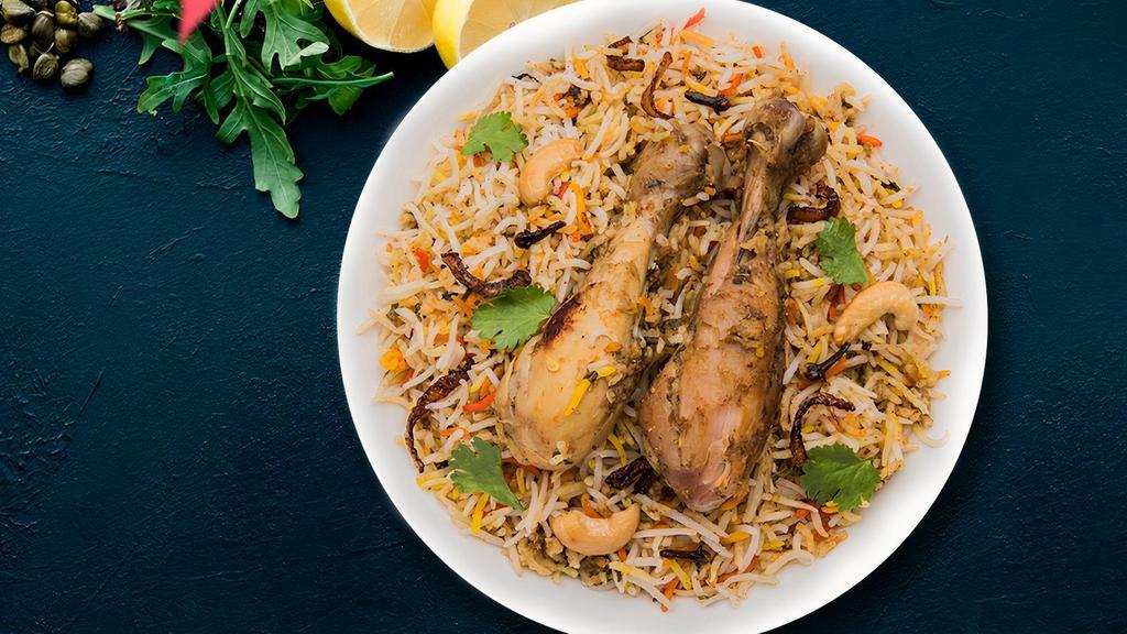 Fb'S Chicken Biryani · Marinated chicken and saffron flavored basmati rice with herbs and spices, garnished with raisins and cashews.