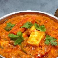 Kadai Tofu Curry · Tofu cooked in house with special masala and sliced onions, tomatoes, ginger and bell peppers.