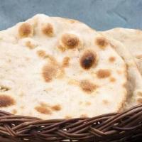 Roti · Whole wheat bread baked in a tandoor clay oven.