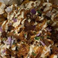 Bbq Ranch Fries · Hand cut fries topped with our shredded cheese blend with crispy fried chicken, our house sw...