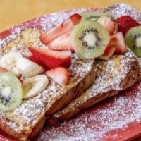 French Toast · Topped with fresh strawberries, bananas, kiwi, powdered sugar and butter.