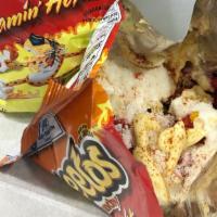 Cheetos With Elote  · Hot Cheetos with corn right out of the cob, mayo, grated cheese, and ground chile