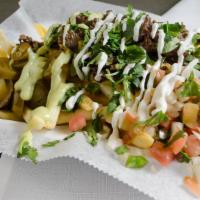Asada Fries Con Queso · French Fries and Grilled Steak with Guacamole, Pico de Gallo, Sour Cream, Nacho Cheese and j...