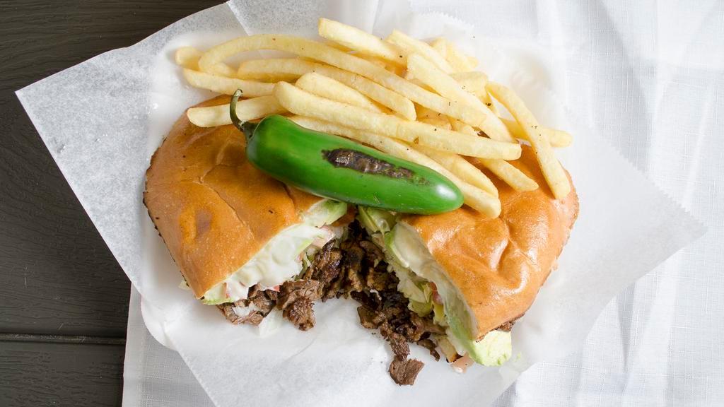 Torta De Carne Asada · Torta with Grilled Steak, Lettuce, Tomato, Cheese, Avocado, Jalapeno, and Mayonnaise.
