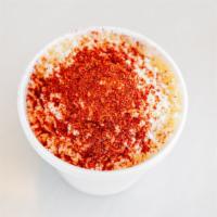 Corn In A Cup · Butter, Mayonaise, Cotija Cheese and Tajin.