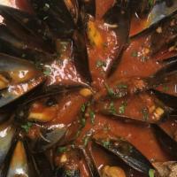 Mussels Al Pomodoro · mediterranean mussels in a tomato basil sauce.
