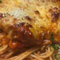 Parmigiana · lightly dusted in breadcrumbs and parmesan cheese, topped with mozzarella, served with spagh...
