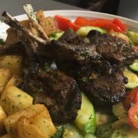 Lamb Chops · grilled lamb chops served with roasted potatoes and vegetables of the day.