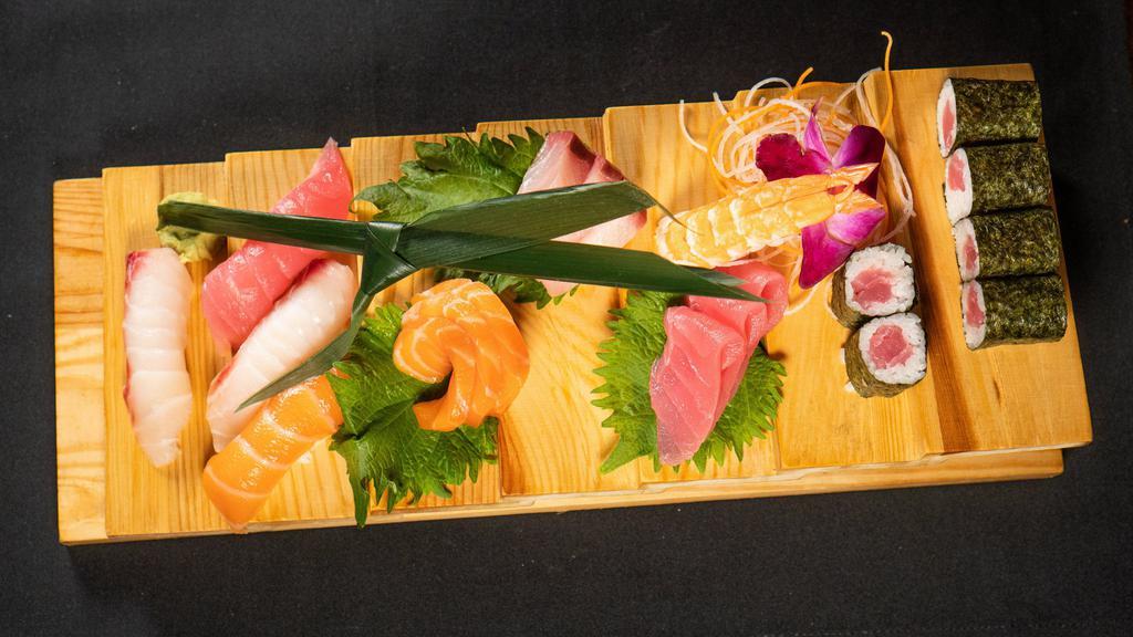 Sushi & Sashimi Combo · Raw fish.5 pieces of sushi, 9 pieces of sashimi & tuna roll.