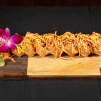 Super Lady · Lobster tempura, cream cheese, avocado, soy paper deep fry and topped with spicy crab meat, ...