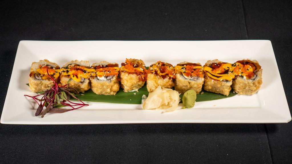 Crazy Maki · Salmon, cream cheese , Jalapeno, dip fry and topped with Eel sauce, spicy mayo sauce , ma-sago , green onion and sesame seed.