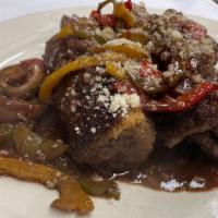 Beef Spiedini · Beef tenderloin wrapped with thin slice of Genoa salami and sauteed with mushroom and peppers.