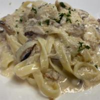 Sea Scallops & Crab Meat  · Sautéed scallops with garlic, mushrooms tossed with crab meat and fettuccine pasta in light ...
