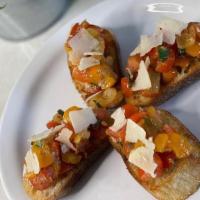 Bruschetta · Tomato, garlic, basil and balsamic vinaigrette served on toasted french bread.
