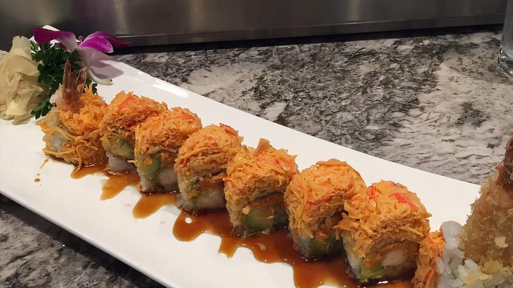 Cowboy Roll · inside: spicy tuna, avOcado and shrimp tempura; Outside: spicy ctabrmeat,
eel and miso sauce