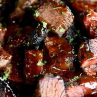 Smoked Bbq Burnt Ends (Gf) · rich, tender chunks of double smoked beef brisket ends tossed in bbq sauce, garnished with p...