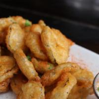 Crispy Dill Pickles · beer battered, house made garlic dill pickle chips, served with buttermilk ranch dressing