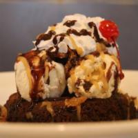 Brownie Sundae · rich chocolate brownie, topped with Ray’s Fat Elvis ice cream, pig candy, salted caramel, co...