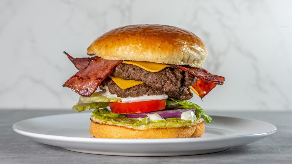 The Fatty Patty Burger · Double home-made beef patty, American cheese, turkey bacon, avocado mayo, lettuce, tomato and onions.