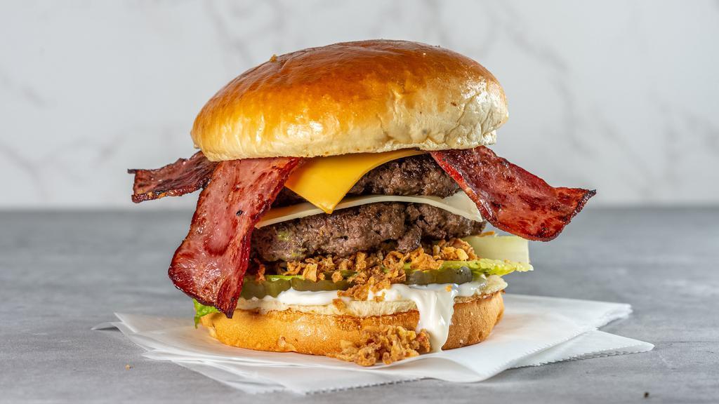Gloppy Burger · Most popular. Double home-made beef patty, American cheese, Swiss cheese, crunchy fried onions, turkey bacon, mayo, sliced pickles and lettuce.