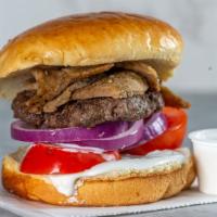 Gyro Burger · Home-made beef patty, gyro meat, tzatziki sauce, lettuce, onion and tomato.