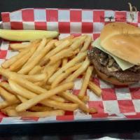 Mushroom Swiss Burger · Angus beef patty brushed with zip sauce, topped with grilled mushrooms & Swiss cheese on a b...
