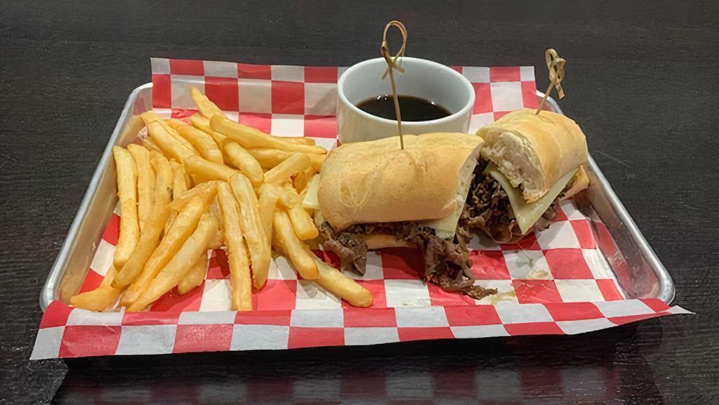 French Dip W/ Side Of Au Jus Sauce · This slices of rib-eye with melted Swiss cheese & grilled onions, served on a grilled hoagie bun with a side of Au Jus sauce. Served with a large side of fries.