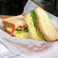 Egg Salad · Includes lettuce and tomato. Served with a pickle spear and your choice of side.