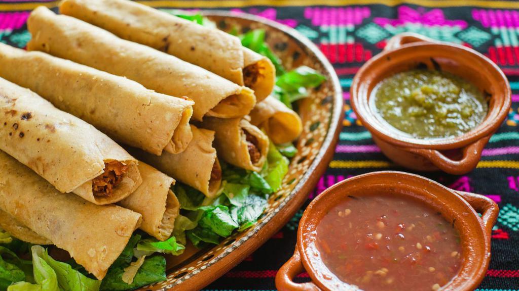 Beef Flautas (3) · Three rolled flour tortillas filled with seasoned beef and fried until crisp. Served with shredded lettuce, diced tomatoes, sour cream and a side of rice and beans.