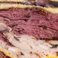 Smoked Corned-Beef Sandwich · Our famous Smoked Corned-Beef with your choice of Swiss or American Cheese, Russian, Mayo, o...