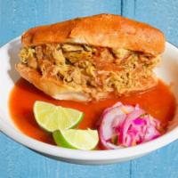 Torta Ahogada · Mexican sandwich filled with carnitas (pork), then