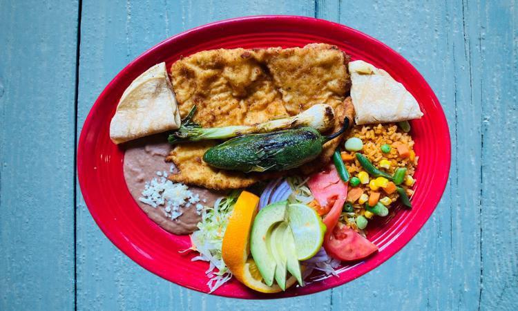 Milanesa De Pollo O Res · Breaded Steak or Chicken served with rice, beans, corn quesadilla, salad, grilled jalapeño and onion.