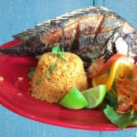 Mojarra Frita · Fried Whole Tilapia with a side of rice and salad.