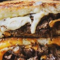 Brisket Grilled Cheese · White Cheddar | Yellow Cheddar | Sourdough | House Smoked Brisket | Caramelized Onions | Sou...