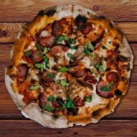 Meat Lovers · Fennel Sausage, Spicy Pepperoni, Ham, Bacon, Smoked Brisket, Mozzarella, Basil Leaves