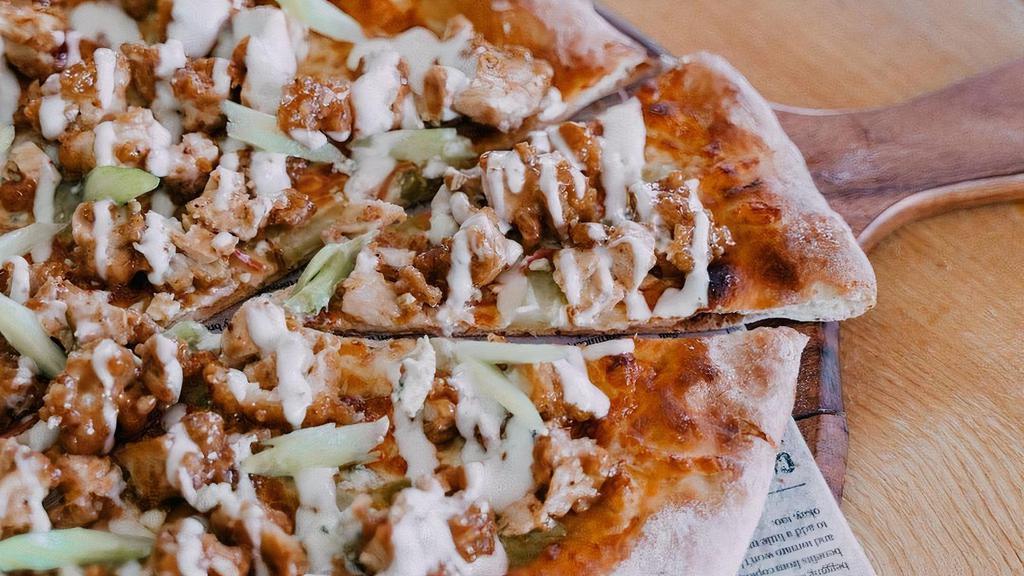 Fried Chicken Pizza · Fried Chicken Tenders, Buffalo Sauce, Mozzarella, Pickled Onion, Pickled Celery, topped with a Ranch Drizzle