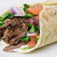 #11. Beef Shawarma Sandwich · Lamb and beef shawarma wrap with tomato, onions pickles, tahini sauce and pomegranate molass...