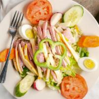 Julienne Salad · Freshly sliced turkey breast, our famous ham off the bone, the finest American and Swiss che...