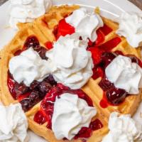 Patriot Waffle · Topped with strawberries, blueberries, and whipped cream.