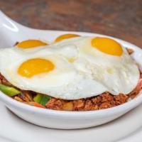 Chorizo Skillet · A skillet of hash browns with chorizo sausage, green peppers, onions, tomato, jalapenos, and...