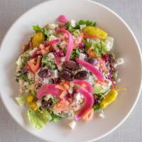 Greek Salad · Mixed greens, feta cheese, pickled onions, Kalamata olives, roasted beets, pepperoncini, tom...