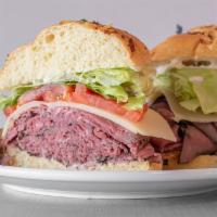 Michigan Rancher · Rare roast beef, lettuce, tomato, Swiss cheese, and horsey sauce on an onion roll.