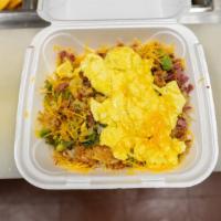 Texas Corned Beef Hash · Served with 2 eggs, fresh corned beef, green peppers, onions and hashbrowns.